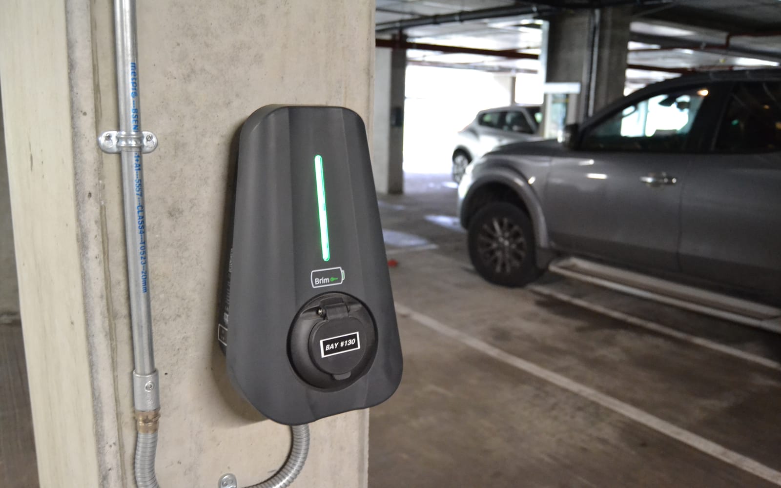 A Brim charger in the undercroft car park of an apartment block